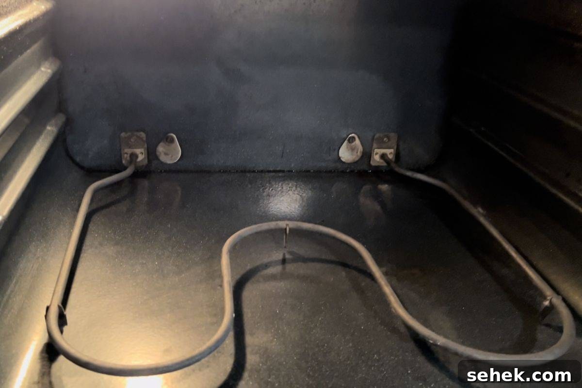 Steam-Clean Your Oven in 2025 Using Simple Kitchen Tools 7 Inside view of an empty oven, after cleaning.