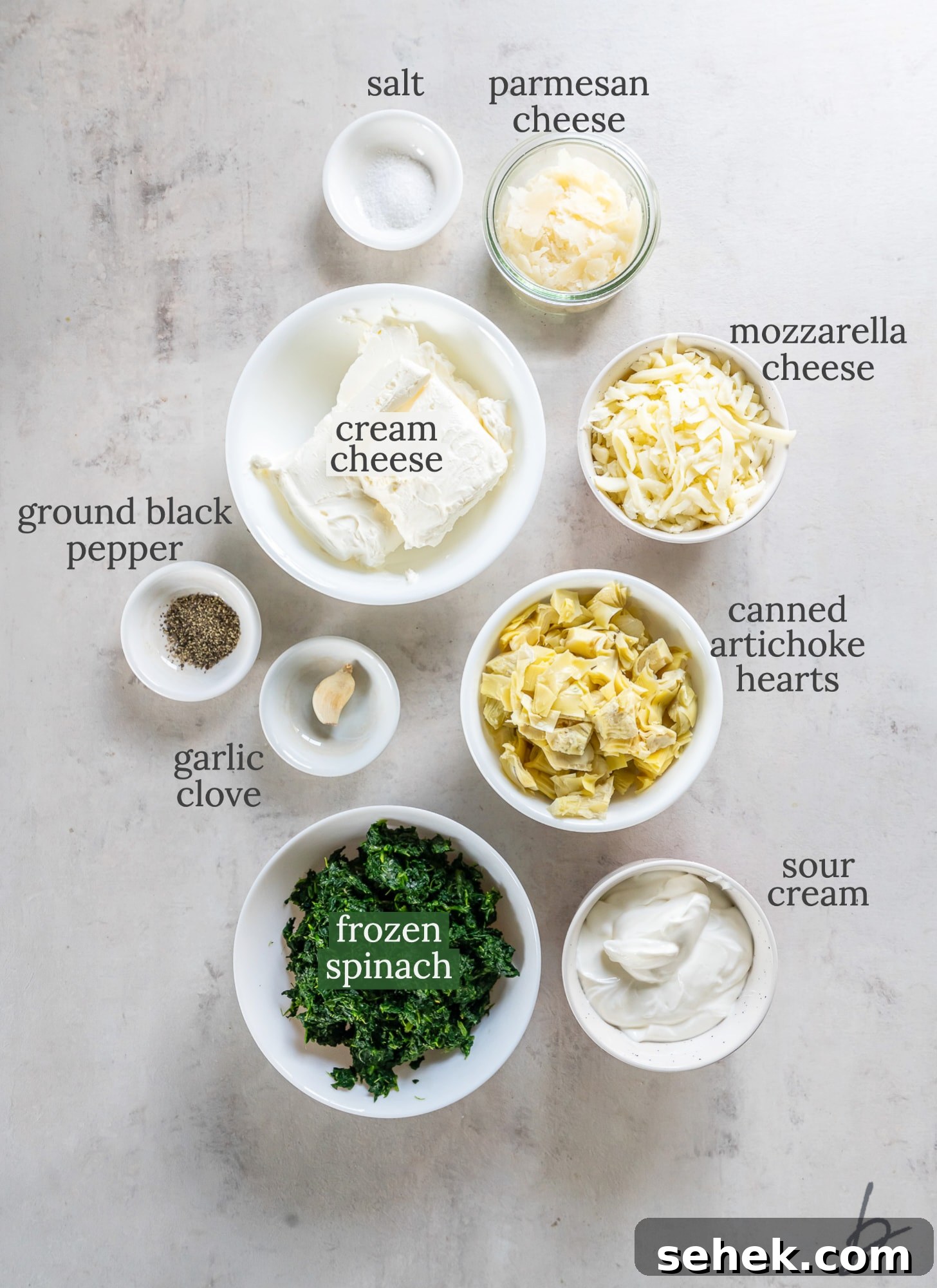 Creamy Slow Cooker Spinach Artichoke Dip Recipe 3 crockpot spinach artichoke dip ingredients in bowls labeled with text