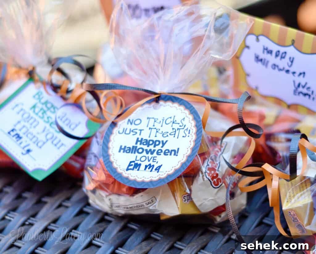 Printable Halloween Gift Tags PDF — Free Downloadable Labels 3 round halloween gift tag on a bag of candy.