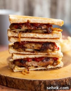 3 sandwich halves stacked on each other with filling showing