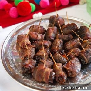 Bourbon Bacon-Wrapped Dates: Sweet, Savory Party Bites 7 bacon wrapped dates with toothpicks on a round metal tray.