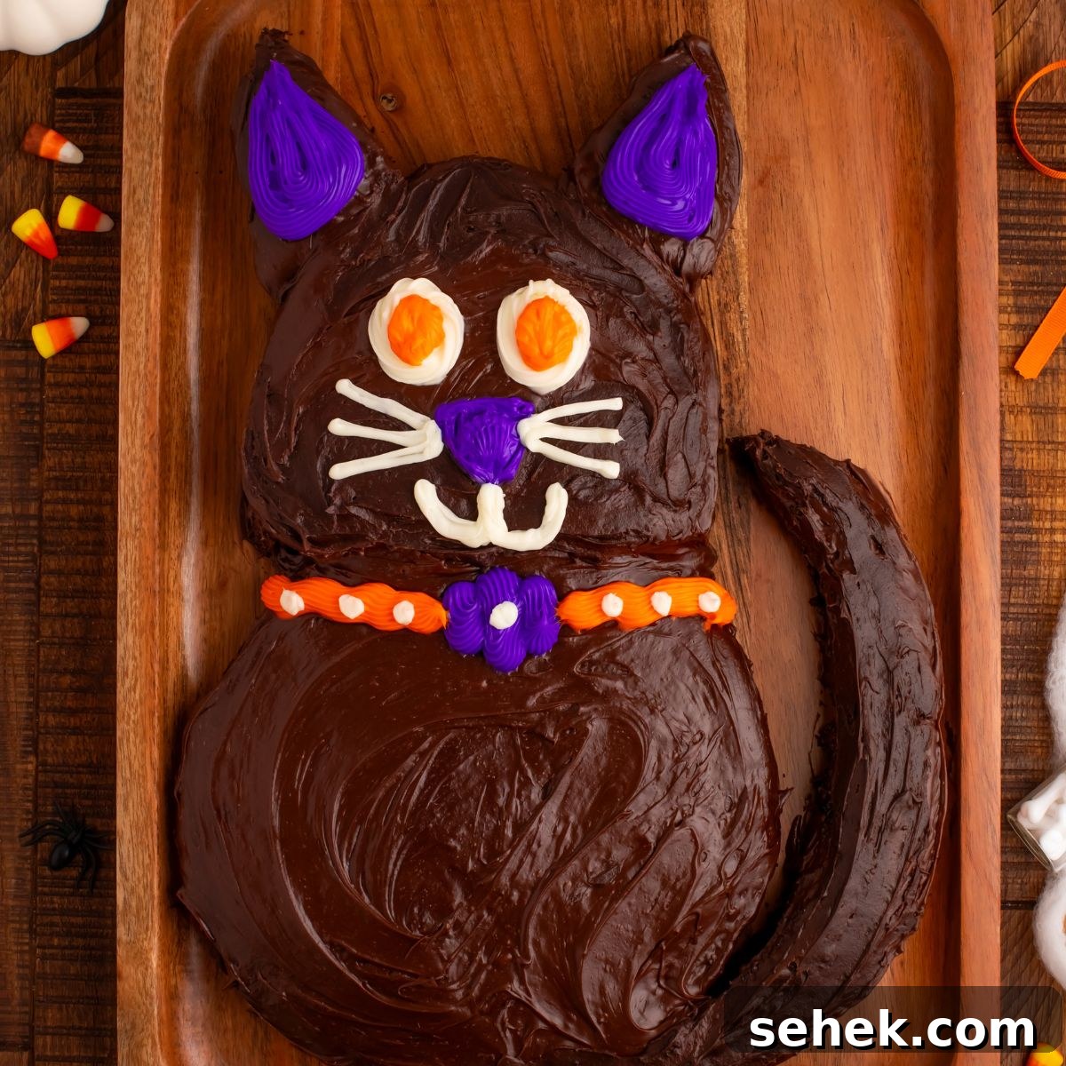 Halloween Black Cat Cut Out Cake on serving tray sitting on table 