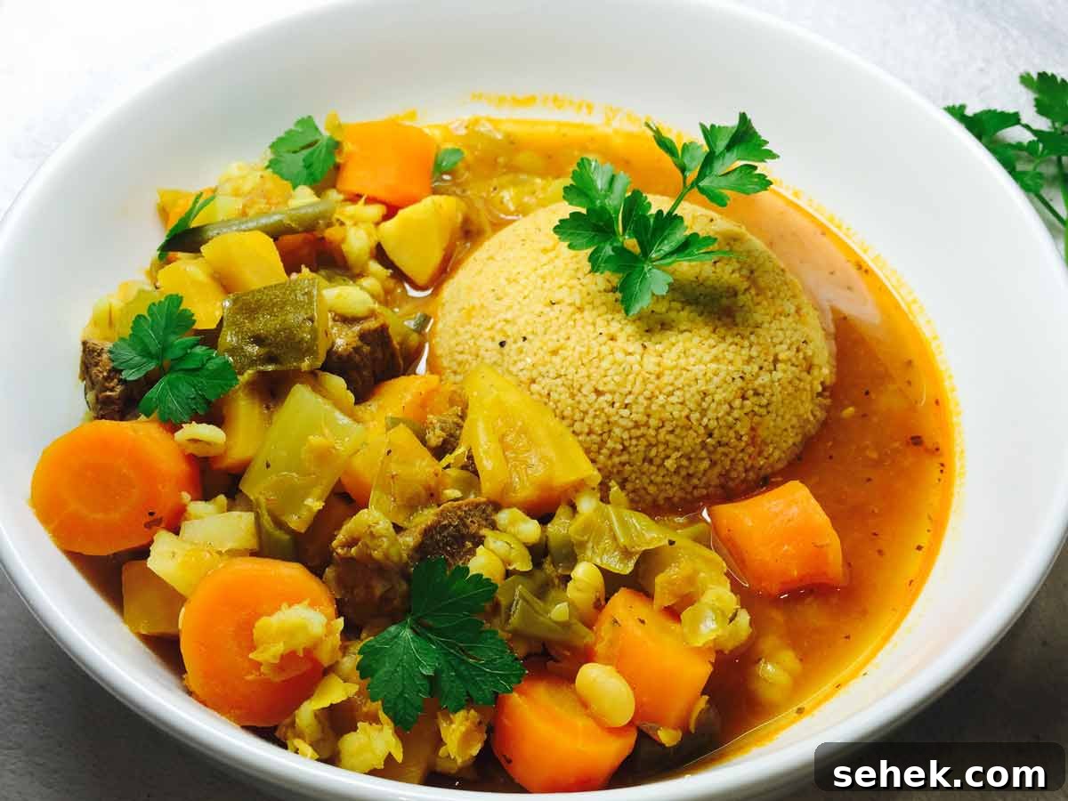 Hearty Lamb Casserole with Fluffy Couscous 2 Couscous & lamb casserole, in a white bowl