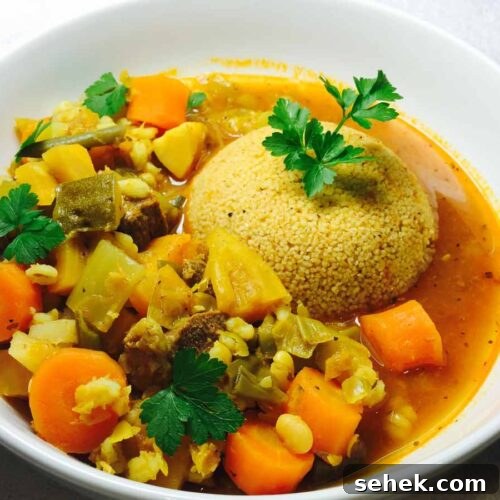 Hearty Lamb Casserole with Fluffy Couscous 3 Couscous & lamb casserole, in a white bowl