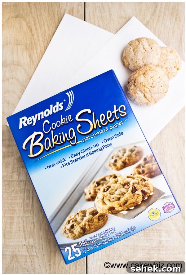 Soft Chewy Cinnamon Cookies Recipe 5 Reynold's Baking Sheets on Light Wood Background.