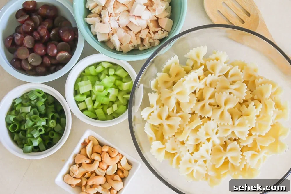 Creamy and fresh Cashew Chicken Salad is tossed in a delicious homemade dressing. It's a perfect summer salad! Cashew Chicken pasta salad ingredients.