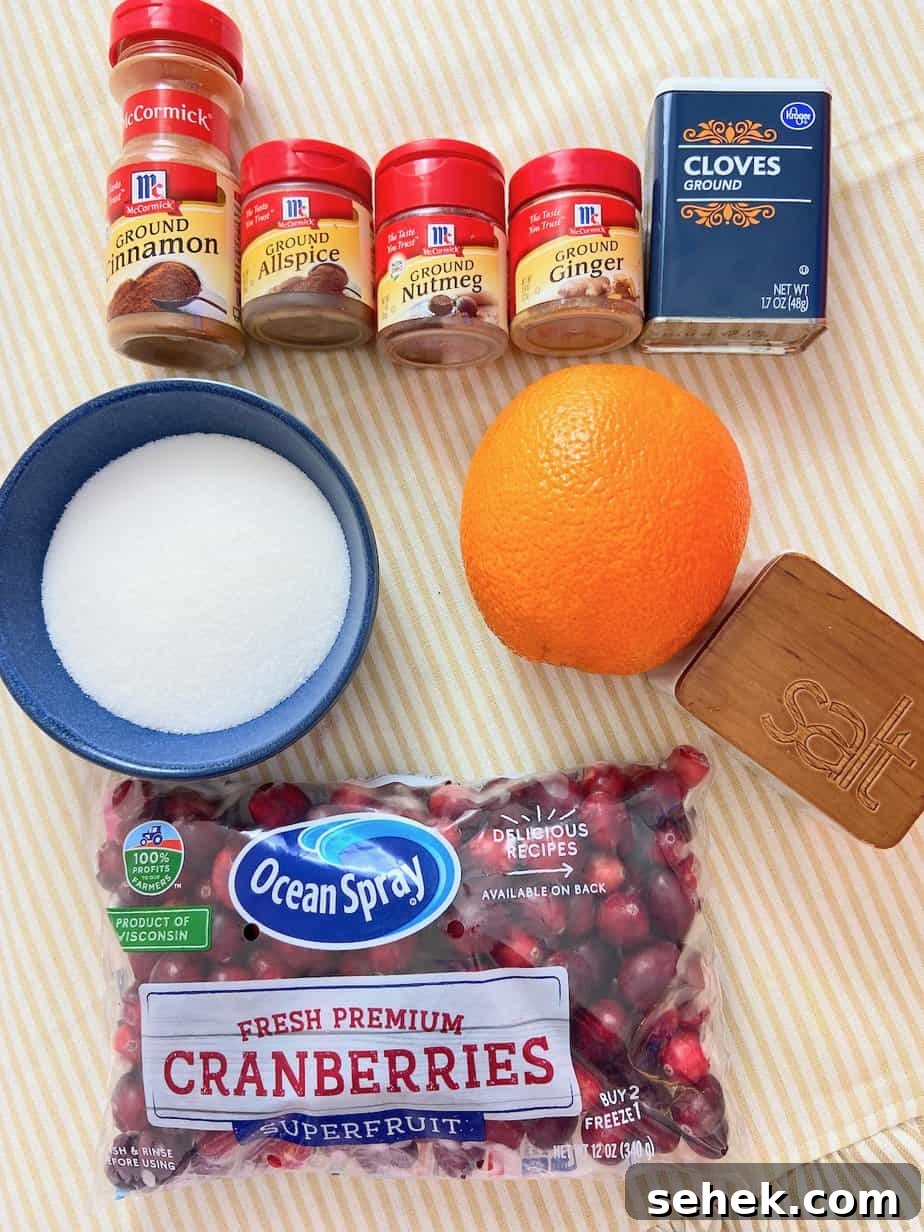 Homemade Spiced Cranberry Sauce with Warm Holiday Spices 3 Ingredients on tabletop.
