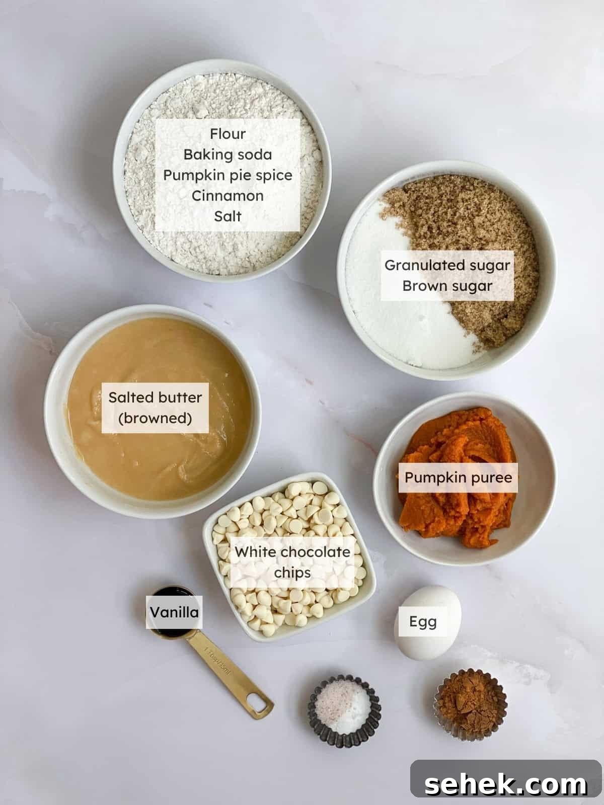 All the ingredients needed to make white chocolate pumpkin cookies.