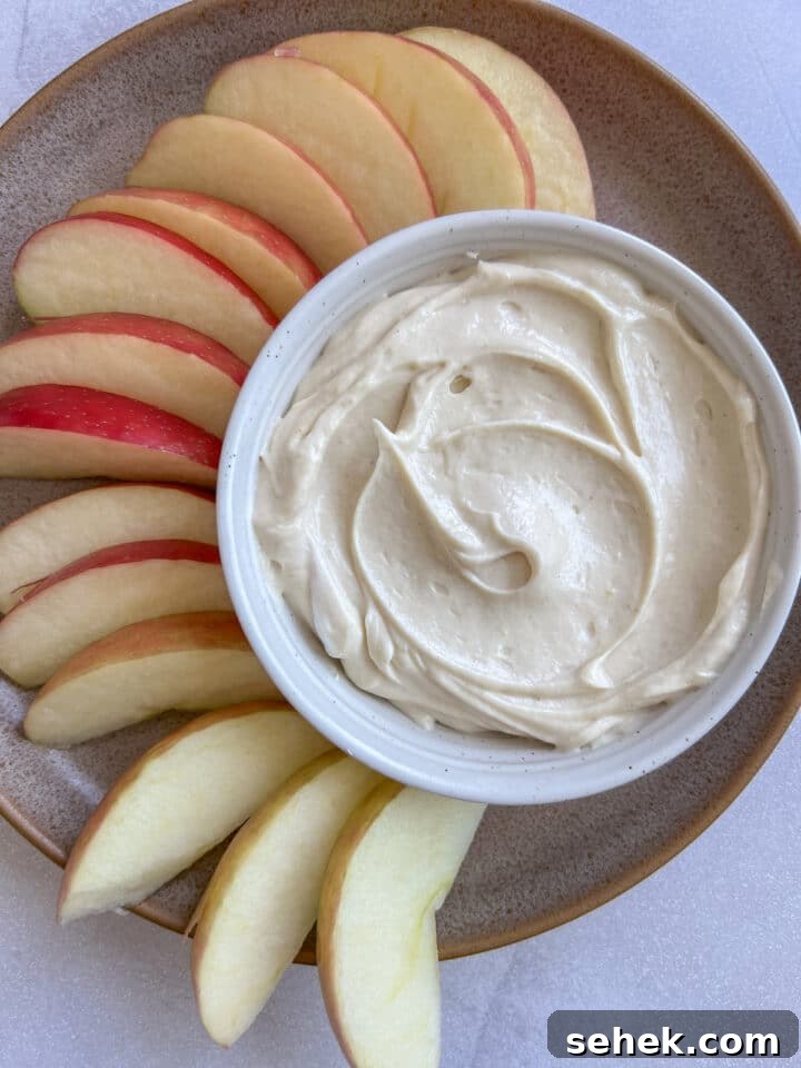 Peanut butter yogurt dip paired with slices apples