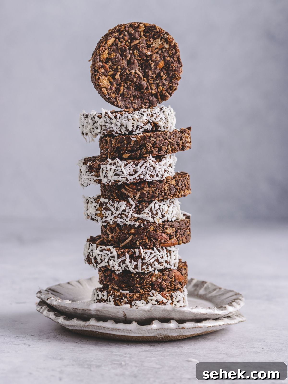 Chocolate Cornflake Cakes with Rice Krispies: No-Bake Treats 2 chocolate rice crispies cakes stacked up on a plate.