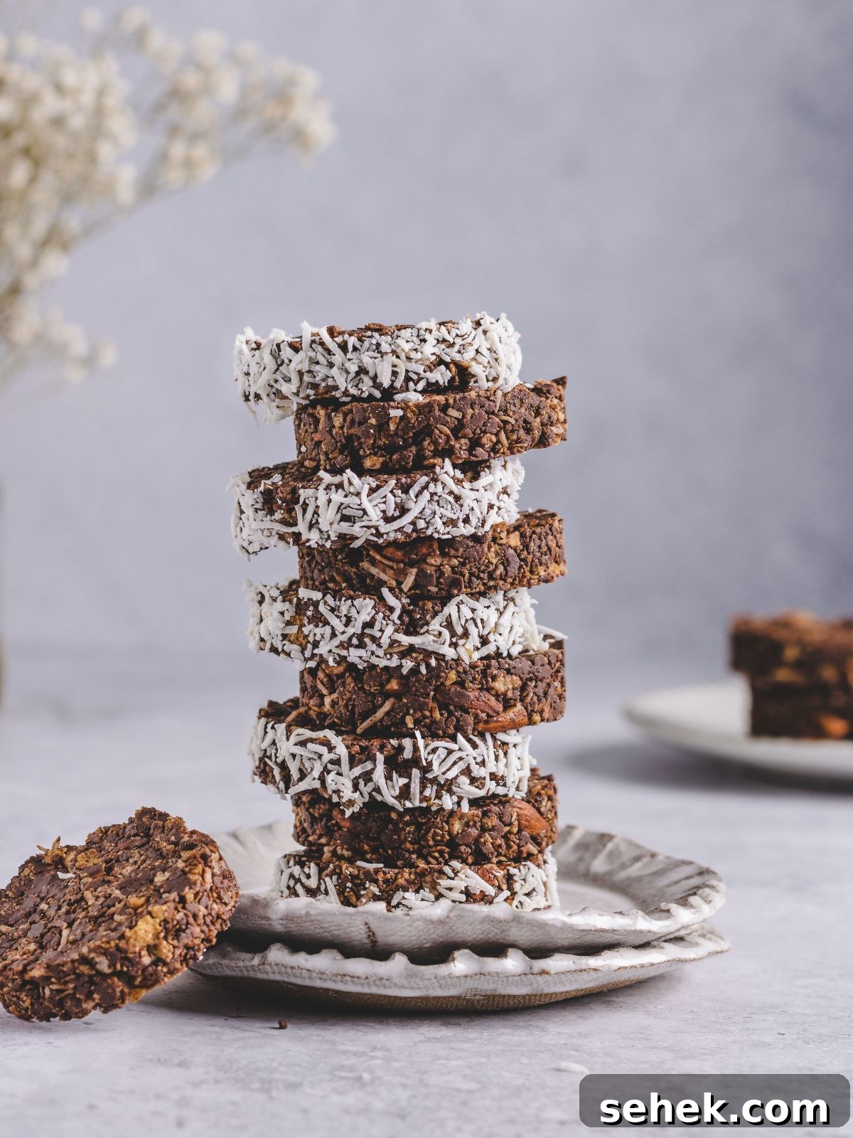 Chocolate Cornflake Cakes with Rice Krispies: No-Bake Treats 4 cereal cakes stacked on a plate.