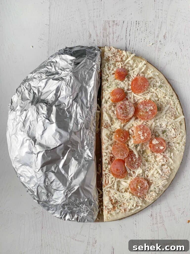 10 Budget-Friendly Gluten-Free Tips to Save Money 7 A frozen margarita pizza cut in half, half is wrapped in foil.
