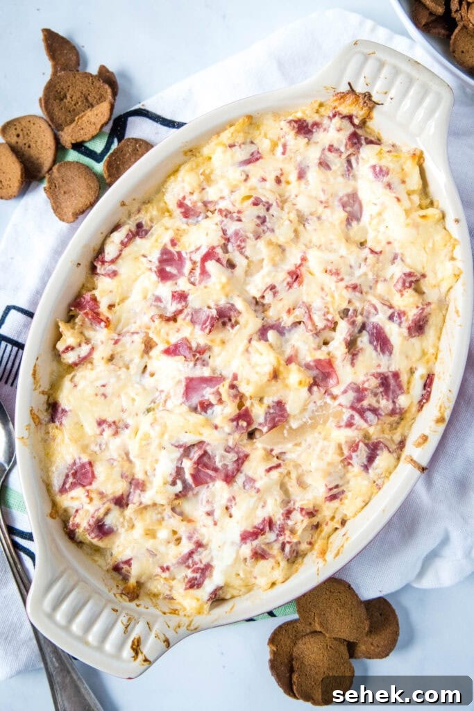 Creamy Reuben Dip Recipe with Corned Beef and Sauerkraut 2 looking down on baking dish with reuben dip