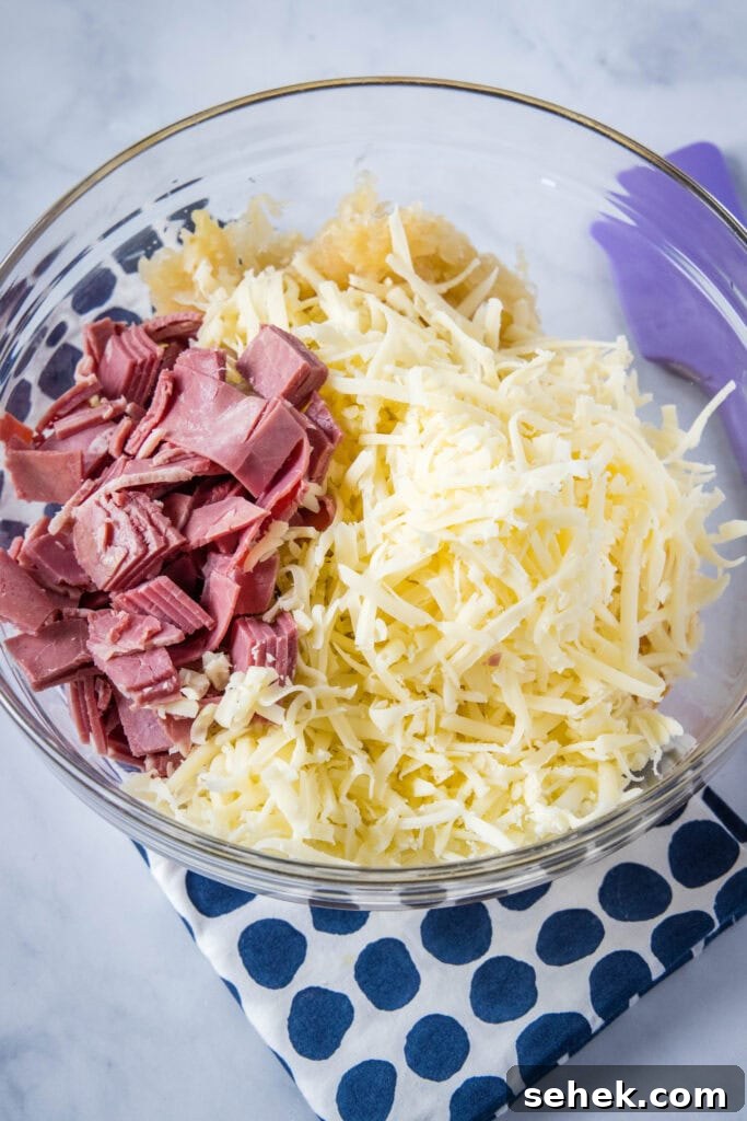Creamy Reuben Dip Recipe with Corned Beef and Sauerkraut 4 reuben dip ingredients in a mixing bowl