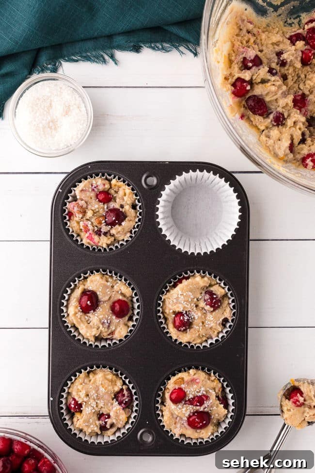 Cranberry Pecan Muffins: Perfect Bake Sale Treat 8 muffin batter in a cupcake pan