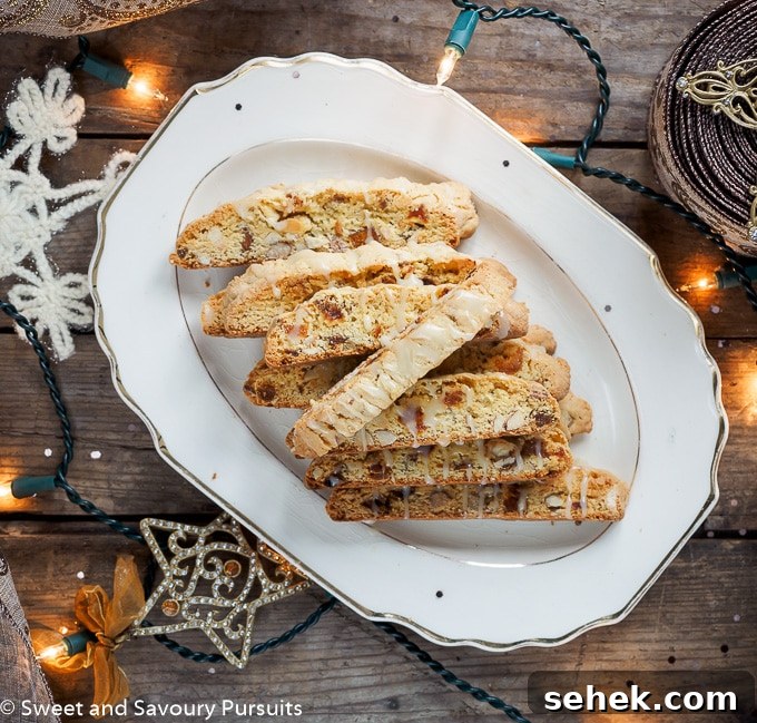 Apricot Almond Biscotti with White Chocolate Drizzle 3 Apricot and Almond Biscotti with White Chocolate Drizzle on serving platter.