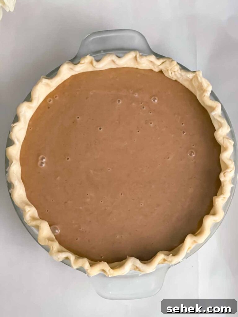 Irresistible Apple Butter Pie Recipe for Fall Baking 7 An apple butter pie, unbaked.