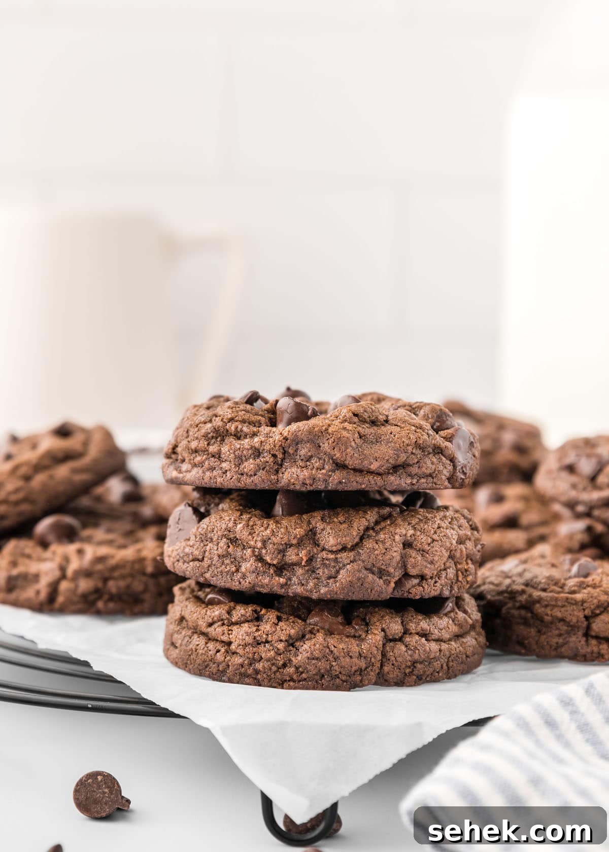 Ultimate Double Chocolate Cookies Recipe for Rich, Fudgy Results 3 A stack of double chocolate chip cookies on a wire rack.