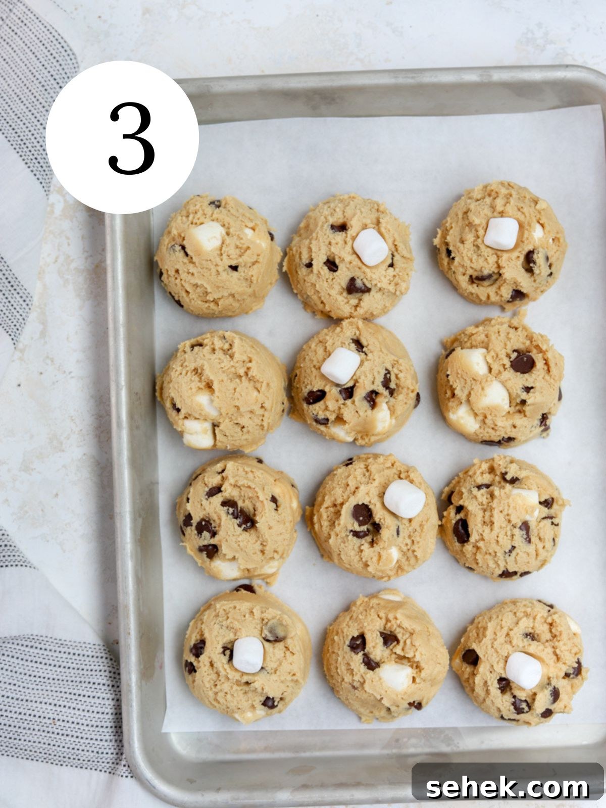 Peanut Butter Marshmallow Cookies Recipe for Soft, Chewy Treats 6 Scooped cookie dough balls on a baking sheet