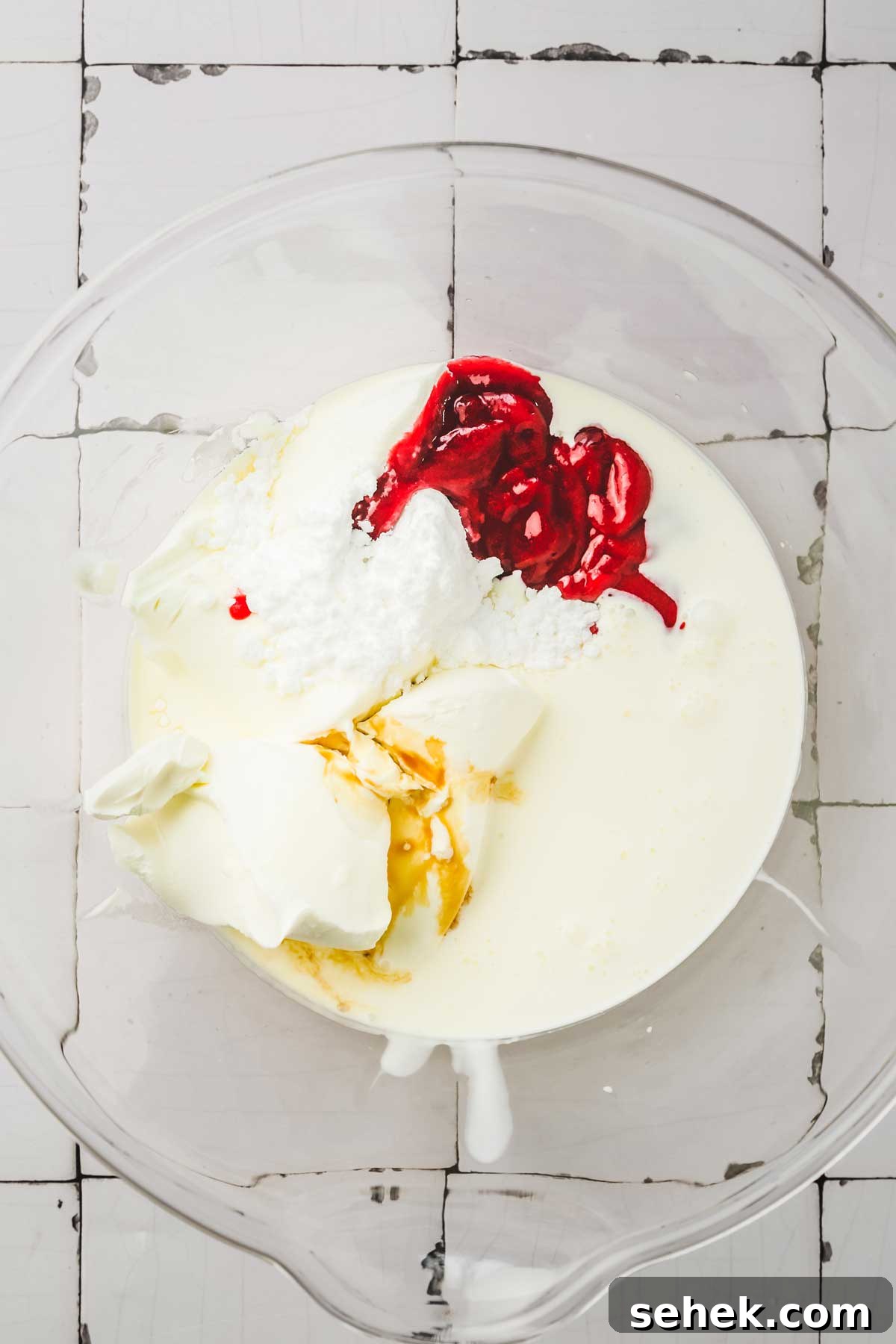Silky Raspberry Frosting Recipe for Cakes and Cupcakes 5 large mixing bowl with raspberry frosting ingredients