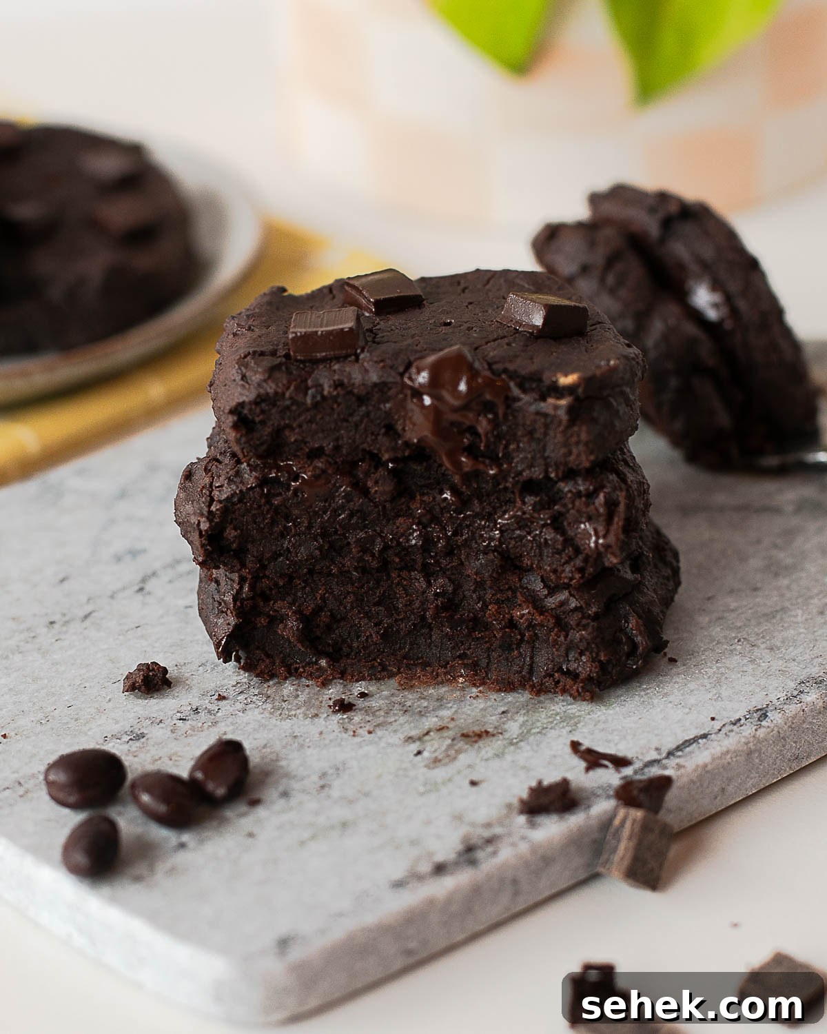 Fudgy Flourless Black Bean Cookies — Vegan Chocolate Treats 3 Fudgy black bean cookie broken open showing gooey chocolate center
