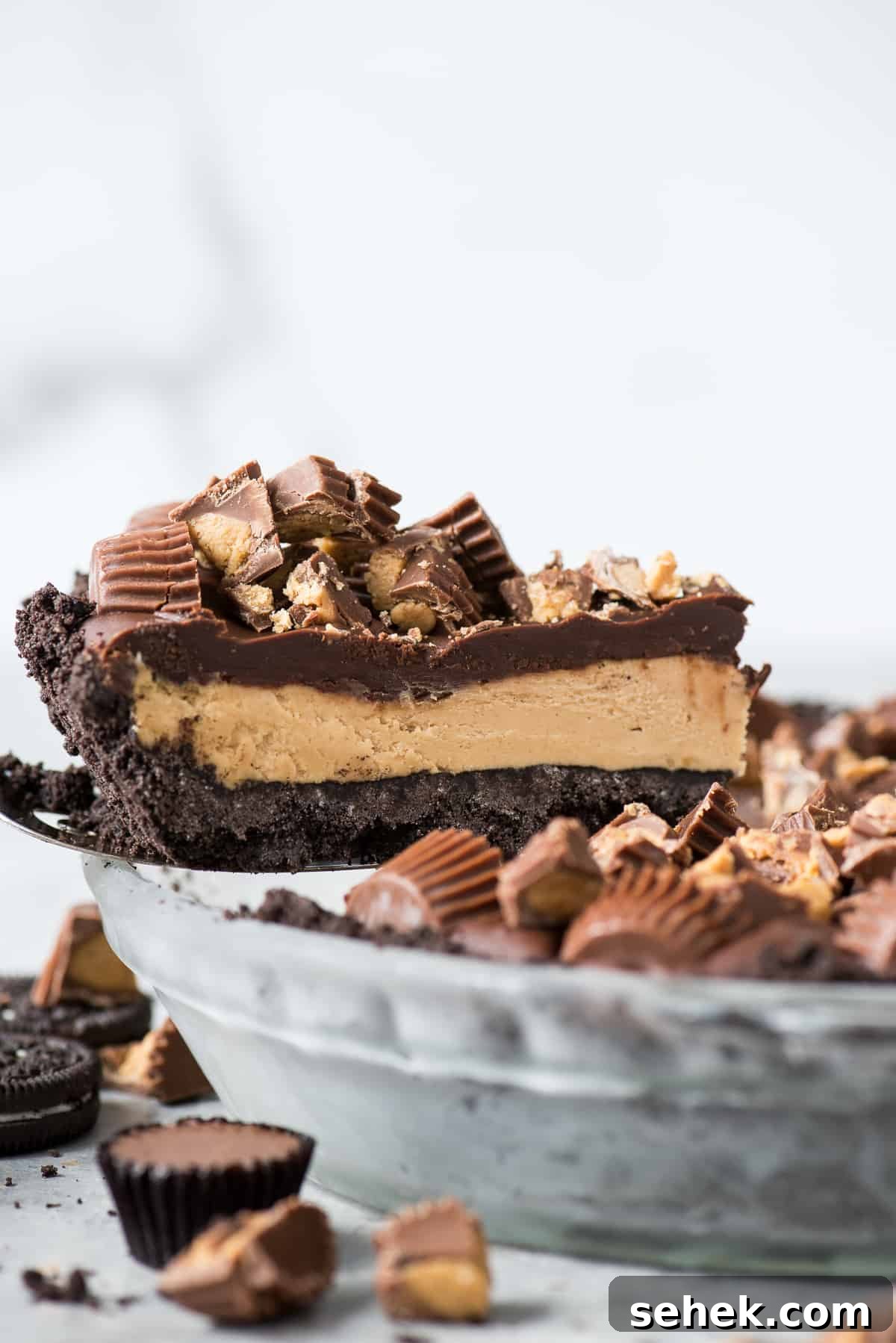 slice of reese's pie being removed from glass pie plate