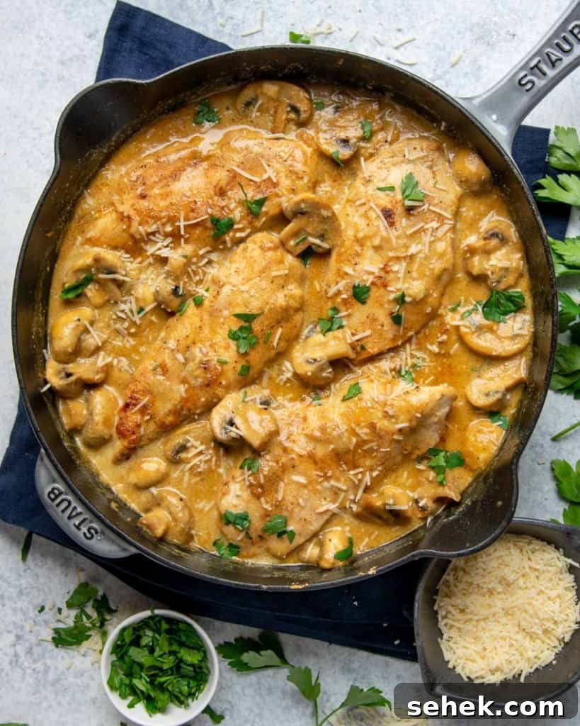 Creamy Dijon Chicken with Mushrooms and Garlic Herbs 3 top view creamy chicken breast in a black skillet