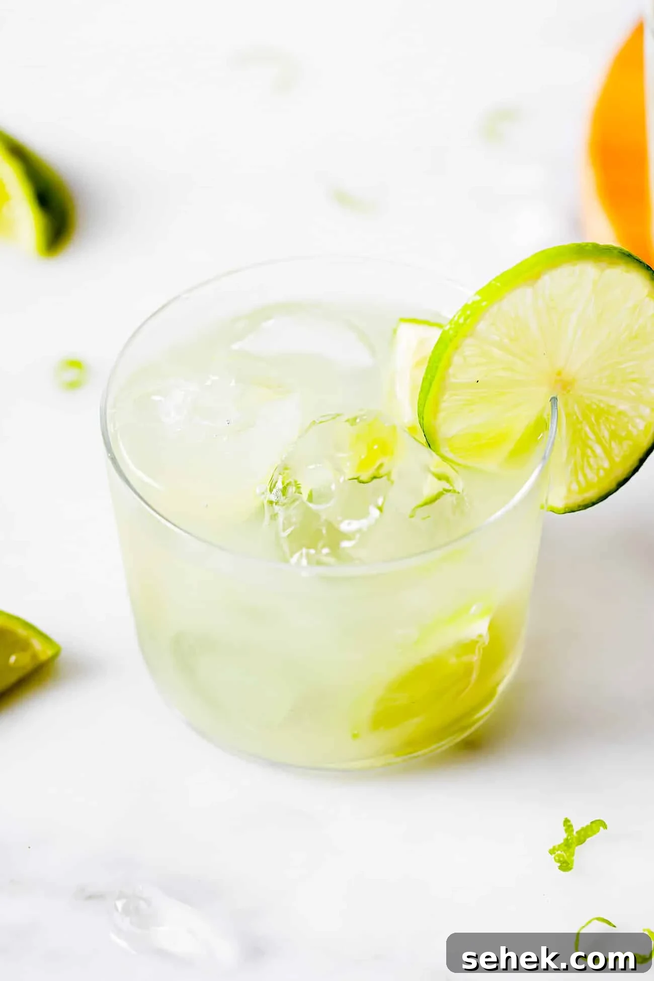 How to Make a Classic Caipirinha: Brazil’s Iconic Cocktail 2 a glass cup of Caipirinha (Brazilian Drink) with a lime wedge