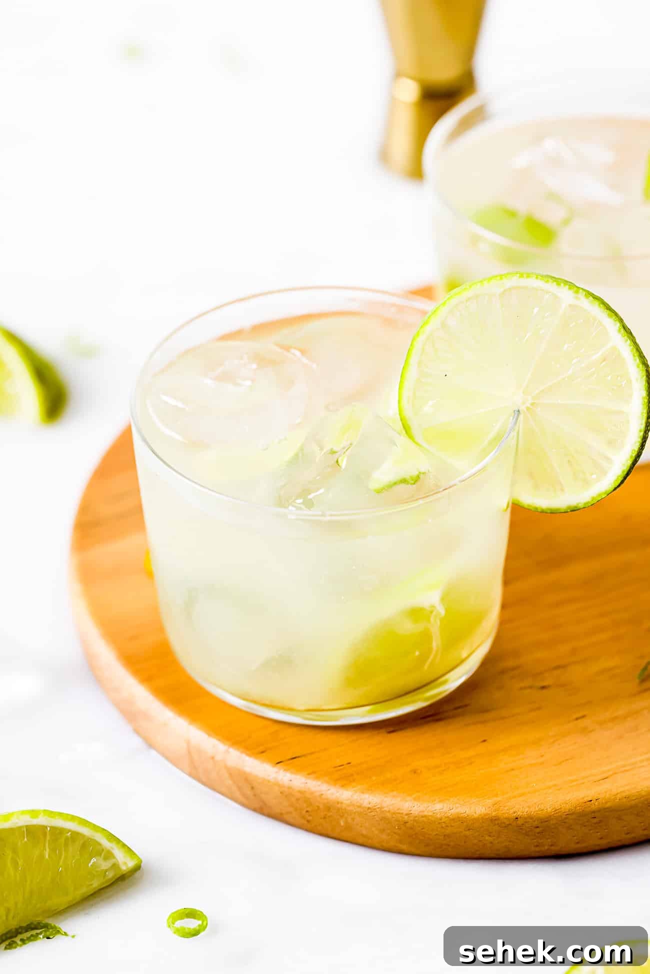 How to Make a Classic Caipirinha: Brazil’s Iconic Cocktail 5 closeup glass cup of Caipirinha (Brazilian Drink) with a lime wedge