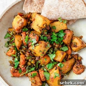 Mixed Vegetable Curry in a bowl with roti inside