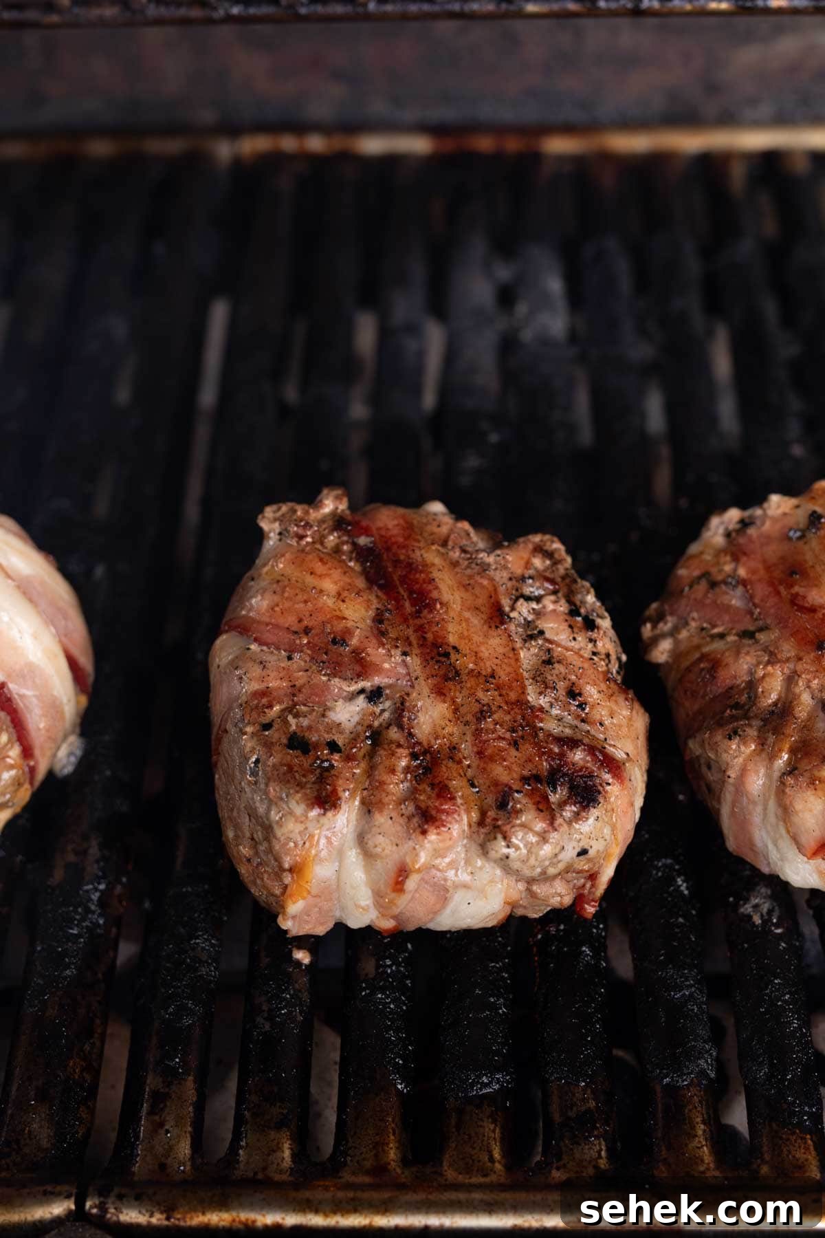 Bacon-Wrapped Burger Recipe: Juicy Grilled Bacon Burger Guide 11 Cooked bacon wrapped burger on the grill