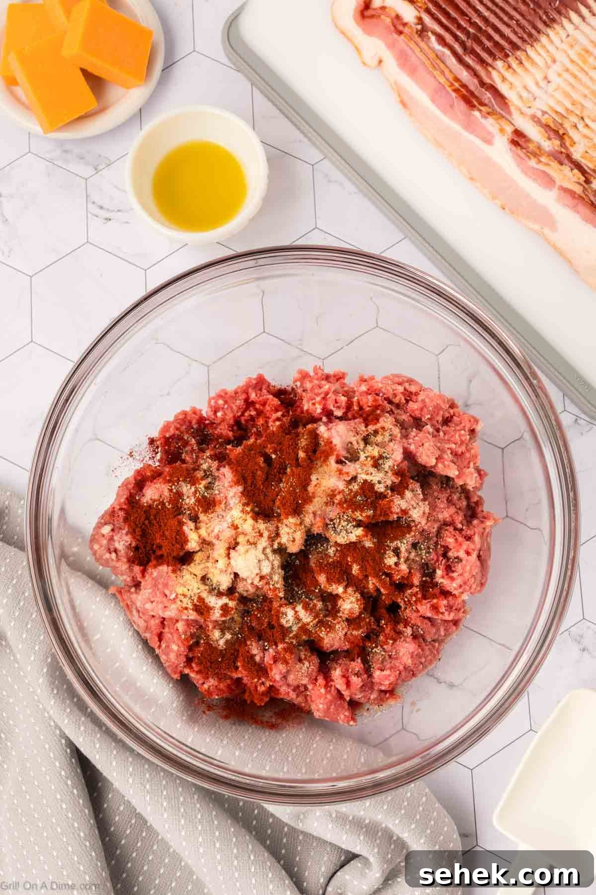 Bacon-Wrapped Burger Recipe: Juicy Grilled Bacon Burger Guide 4 Ground beef topped with spices in a bowl