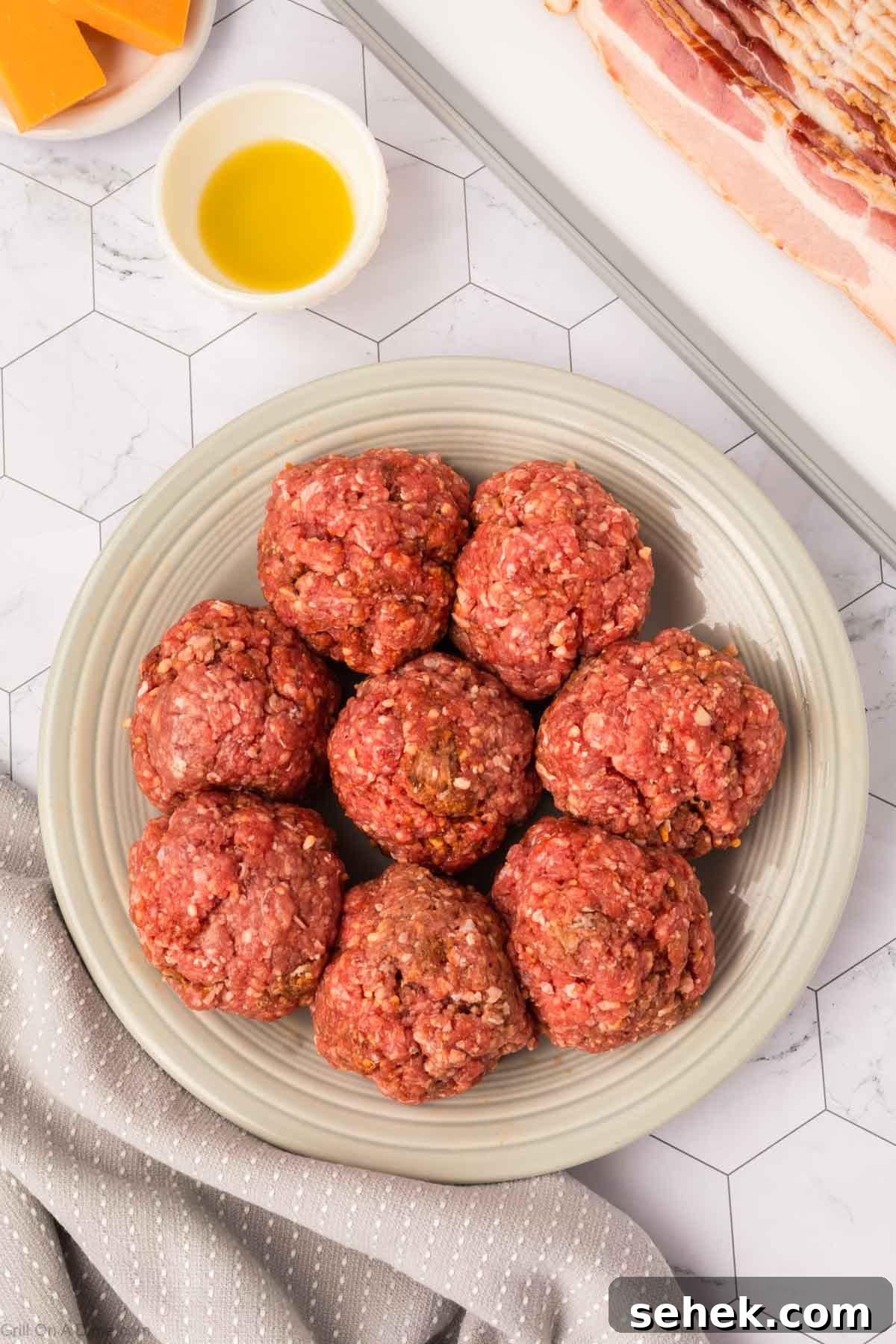 Bacon-Wrapped Burger Recipe: Juicy Grilled Bacon Burger Guide 6 Ground beef Balls on a plate