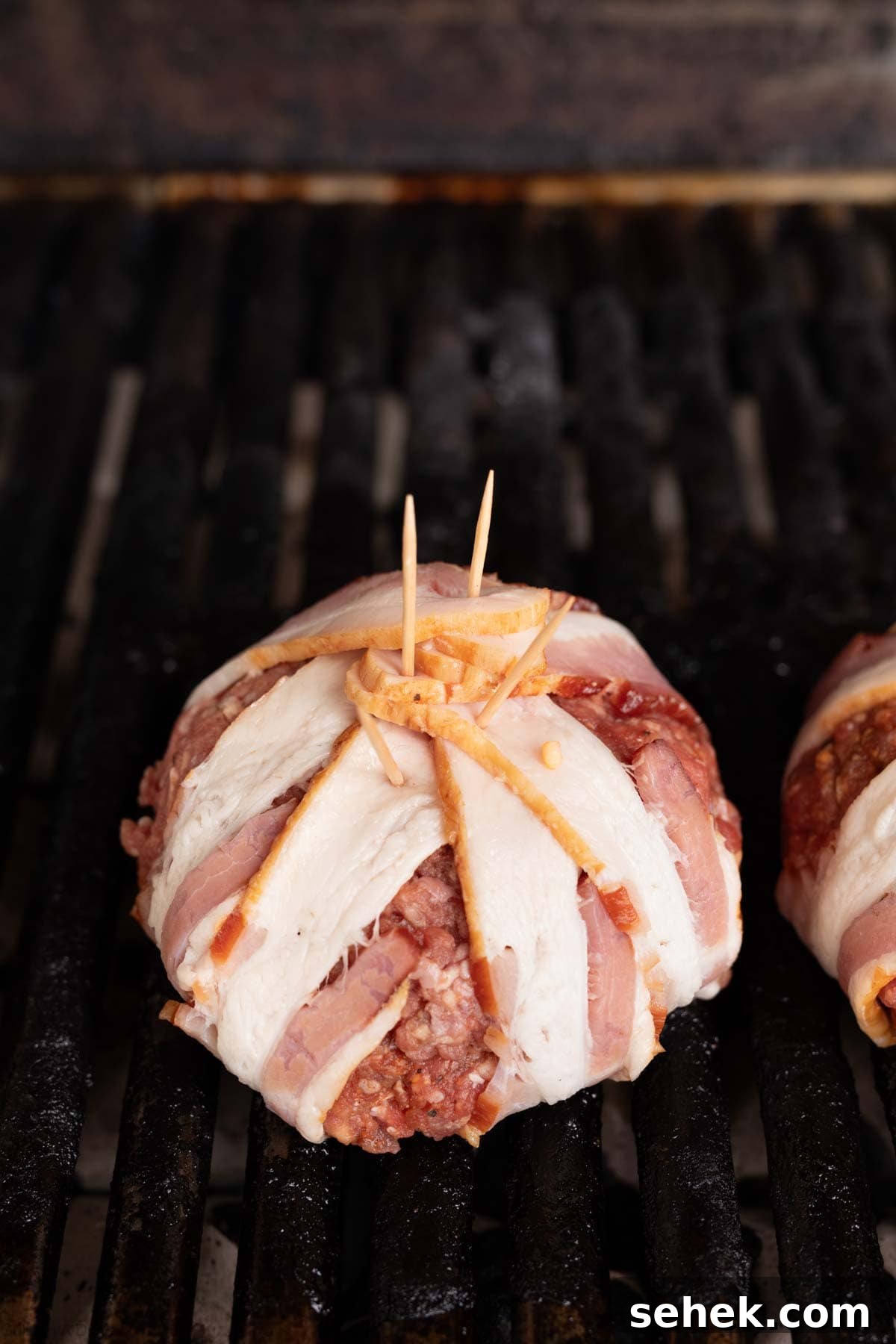 Bacon-Wrapped Burger Recipe: Juicy Grilled Bacon Burger Guide 10 Placing the bacon wrapped ground beef ball on the grill