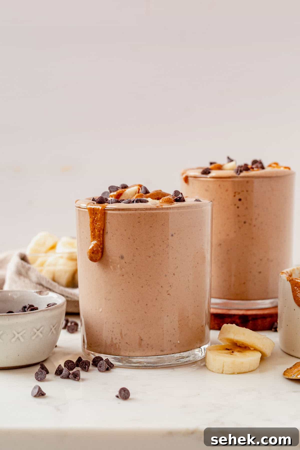 Chocolate Peanut Butter Protein Shake for Muscle Recovery 6 chocolate peanut butter smoothie with protein and topped with peanut butter.