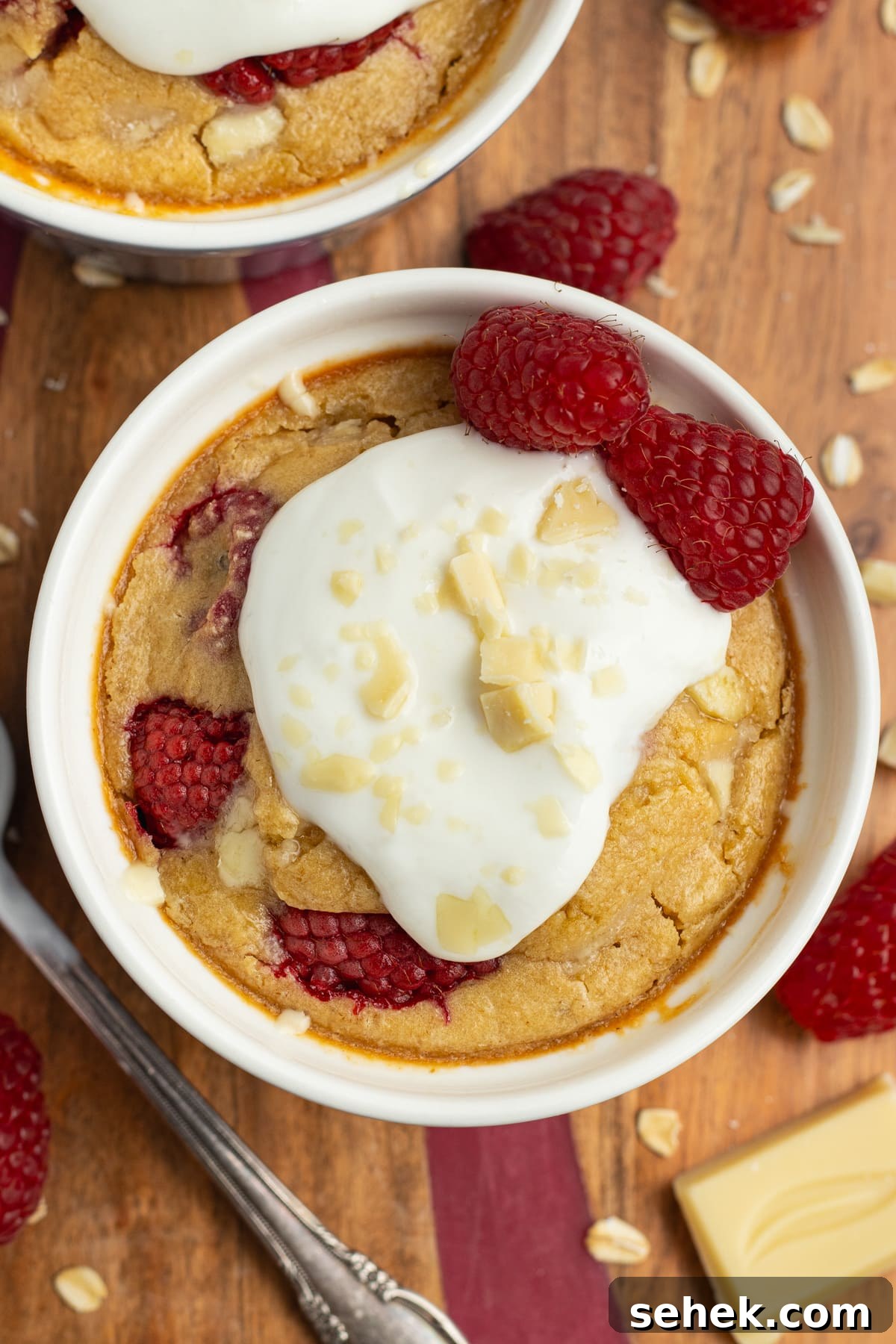 White Chocolate Raspberry Protein Baked Oats 2 This is a picture of the white chocolate raspberry baked oats ready to eat with yogurt on top.
