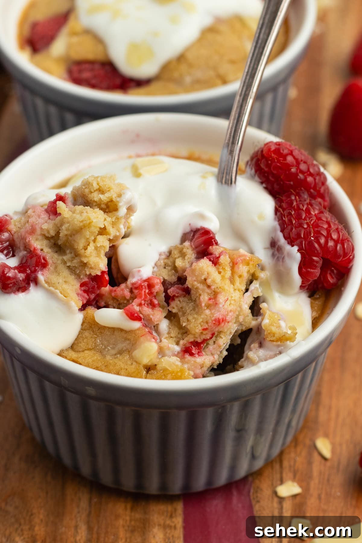 White Chocolate Raspberry Protein Baked Oats 11 This is a picture of the baked oats with the inside showing.