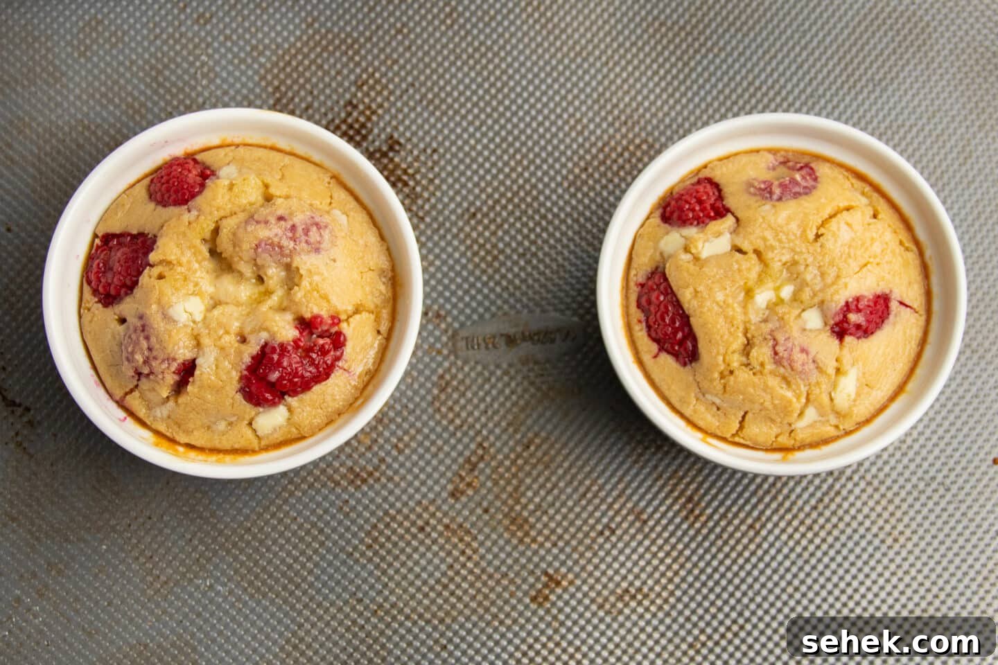 White Chocolate Raspberry Protein Baked Oats 10 This is a picture of the ramekins filled with with baked oats after baking.