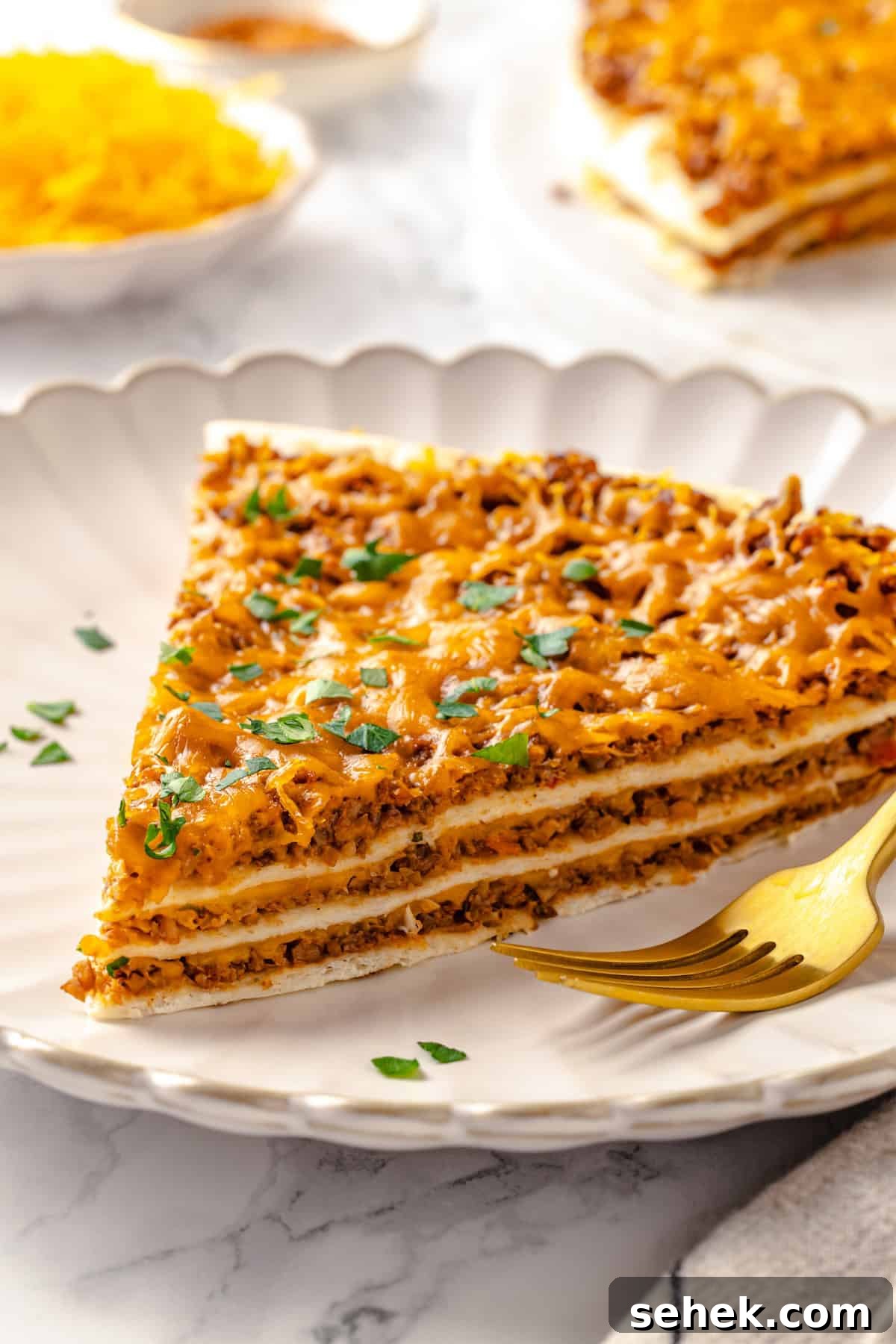 Slice of layered vegan taco bake on plate