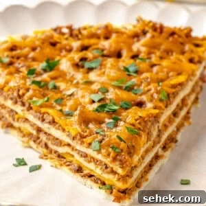 Slice of layered taco bake on plate
