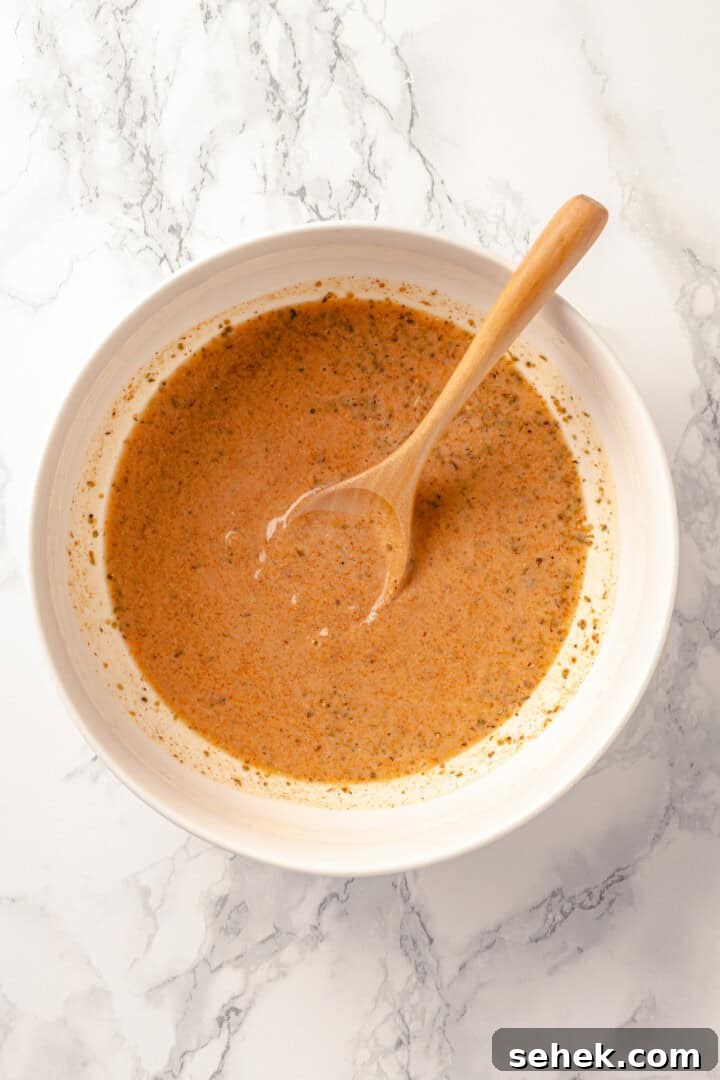 Overhead view of creamy sauce for taco bake