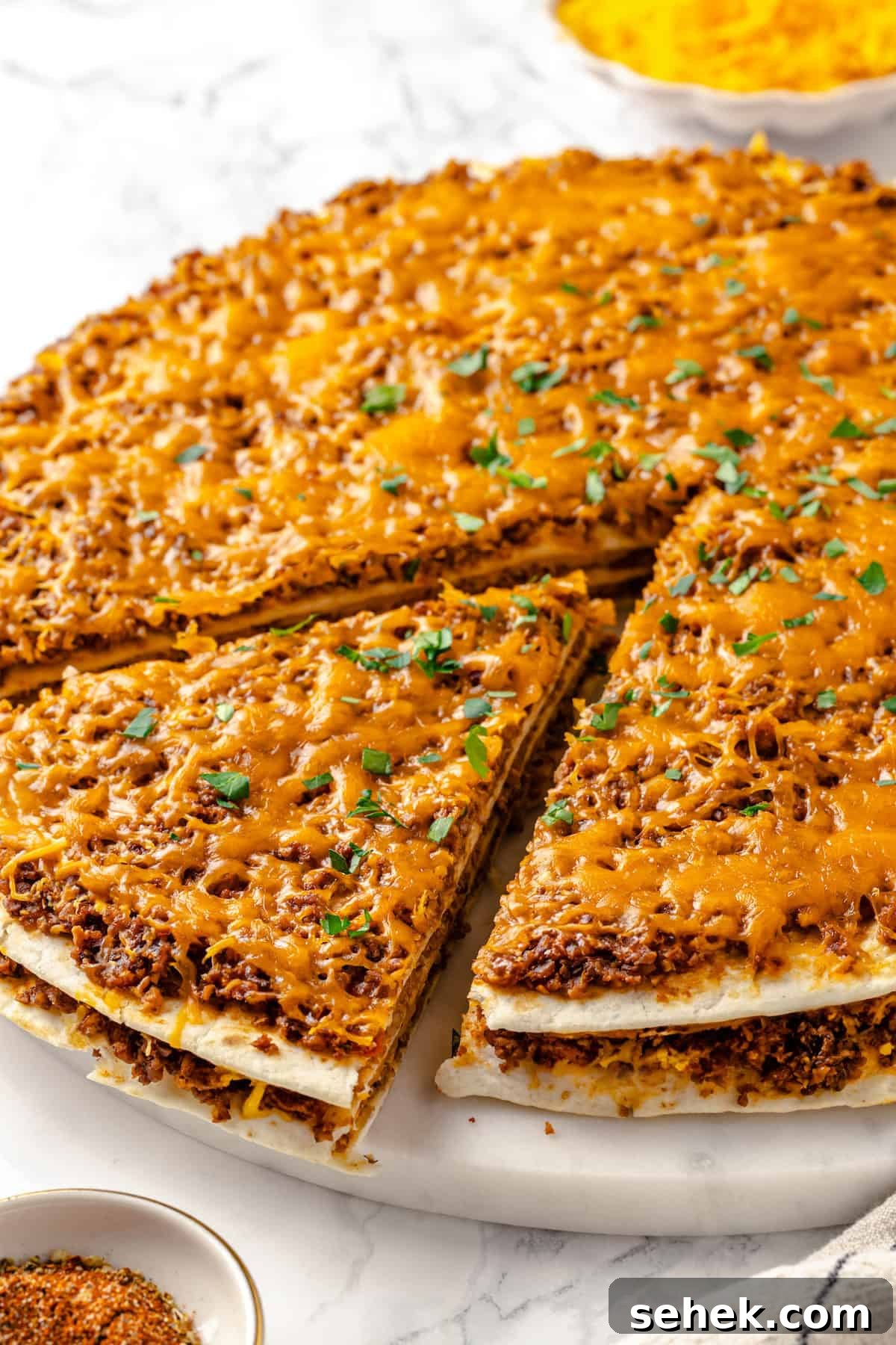 Slice of taco bake being pulled away from the rest