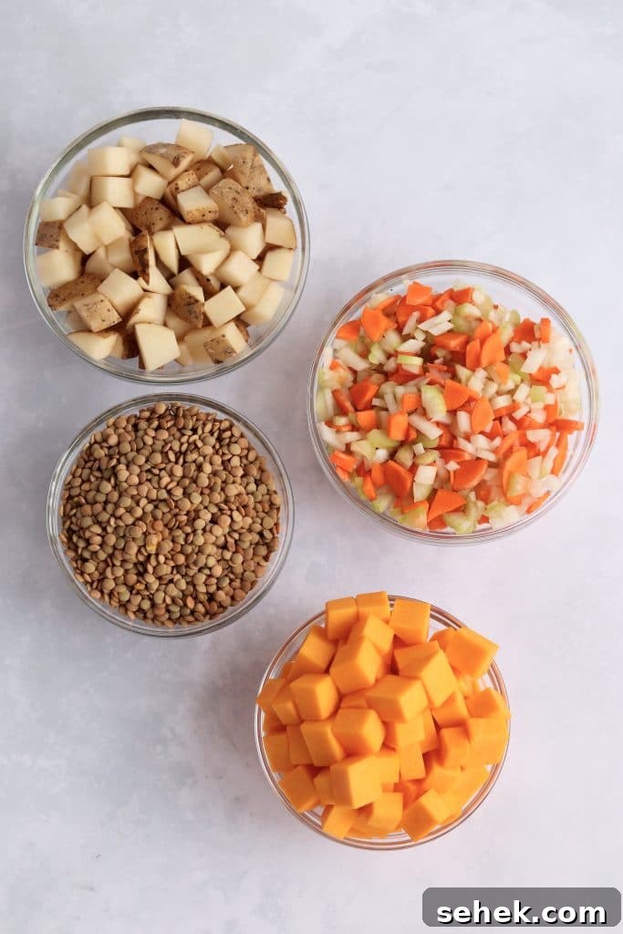 Hearty Vegan Lentil Soup in the Instant Pot — Ready Fast 3 Diced potatoes, mirepoix, lentils, and butternut squash in glass prep bowls