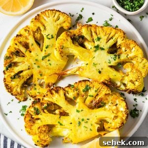 Crispy Air Fryer Cauliflower Steaks with Garlic Herb Sauce 13 air fryer cauliflower steaks with parsley and lemon.