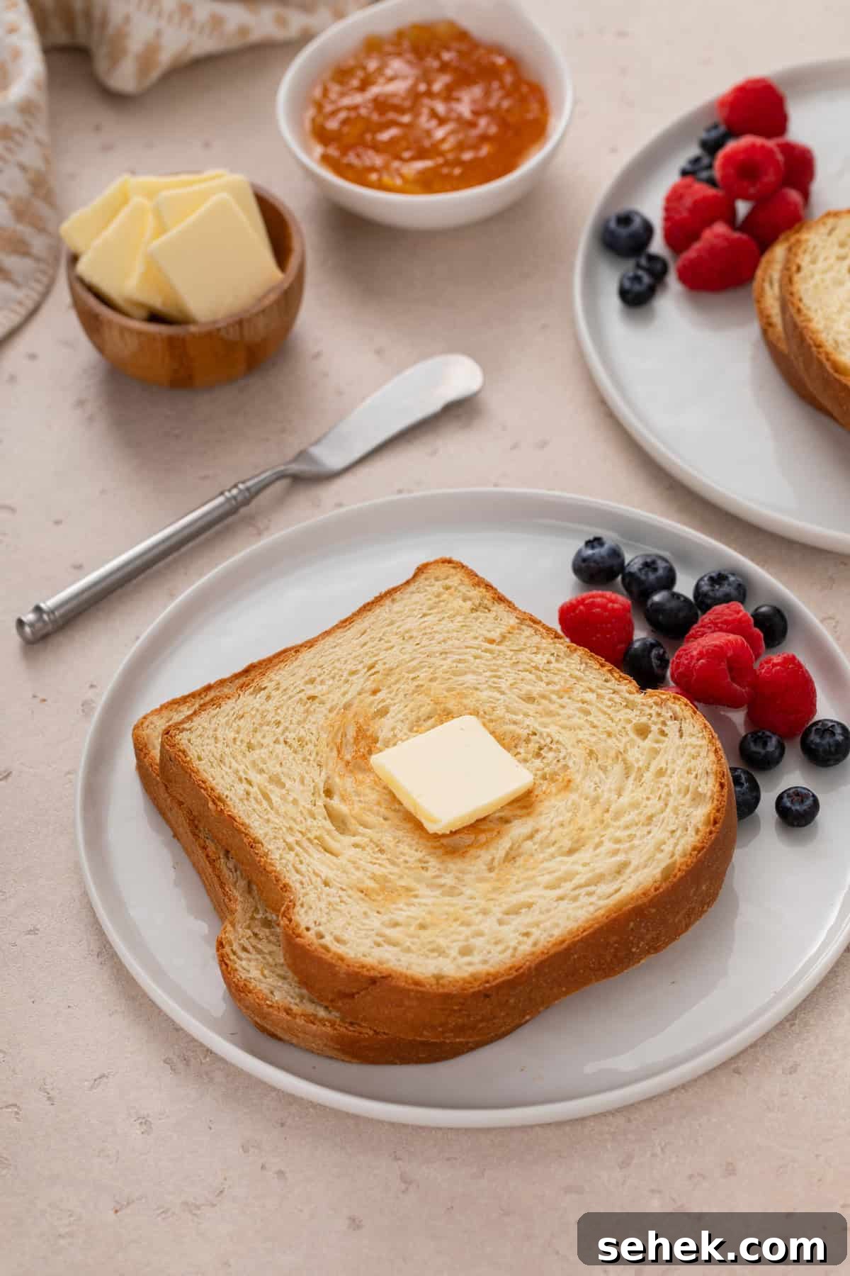 Toasted slices of potato bread on a white plate.