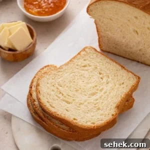 Slices of potato bread on a white cutting board.
