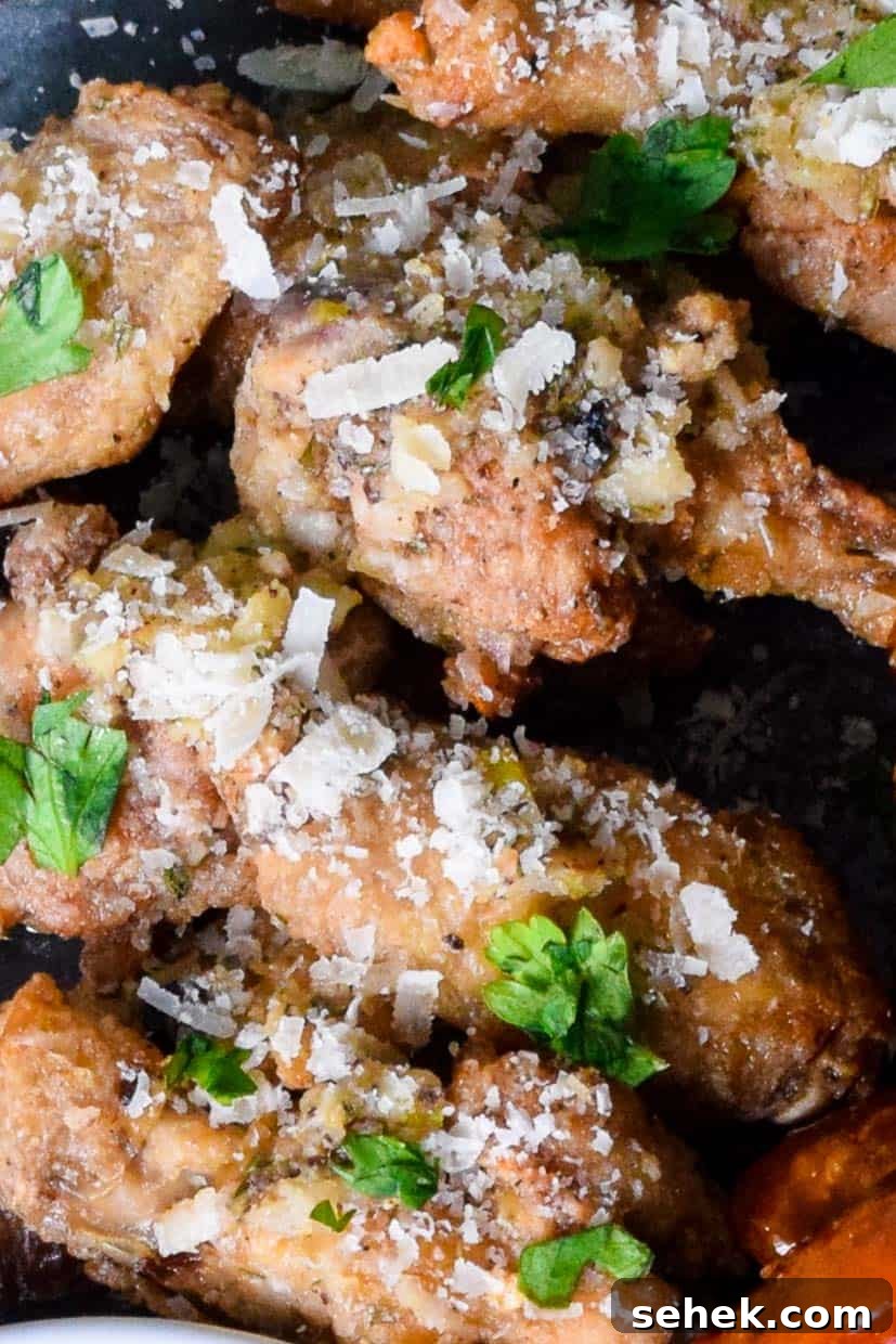 Crispy Air Fryer Wings for Game Day 11 Close up view of air fried garlic parmesan wings