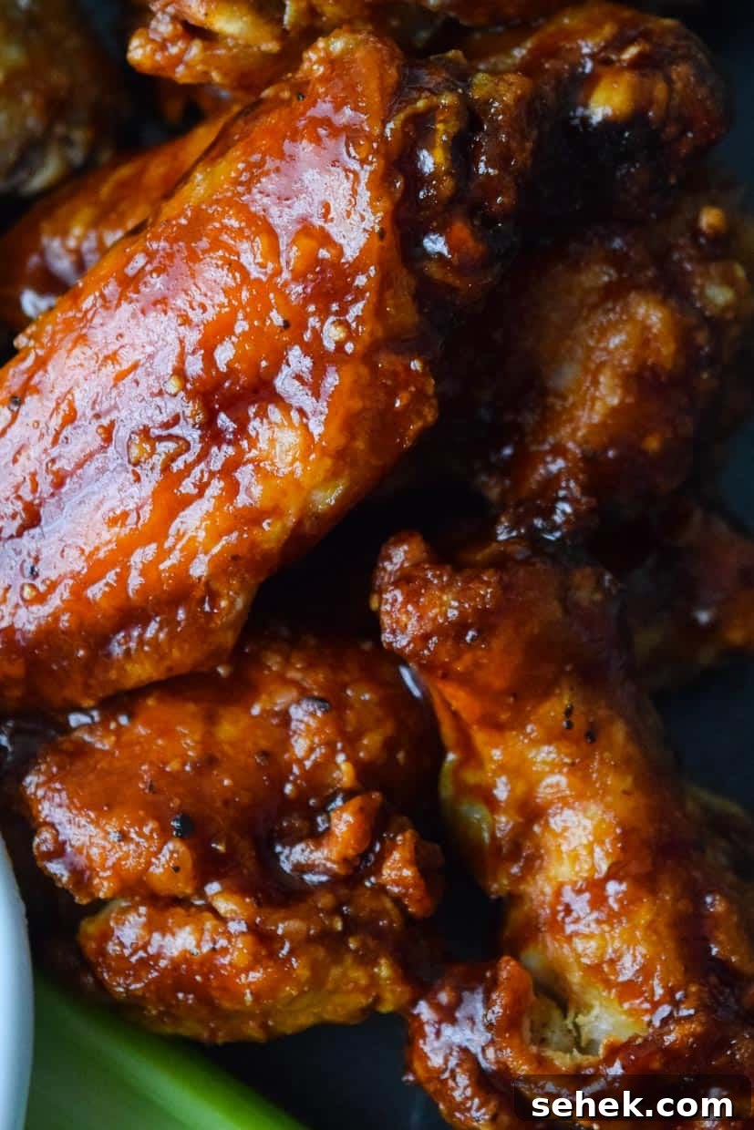 Crispy Air Fryer Wings for Game Day 6 Close up view of air fried sauced BBQ wings