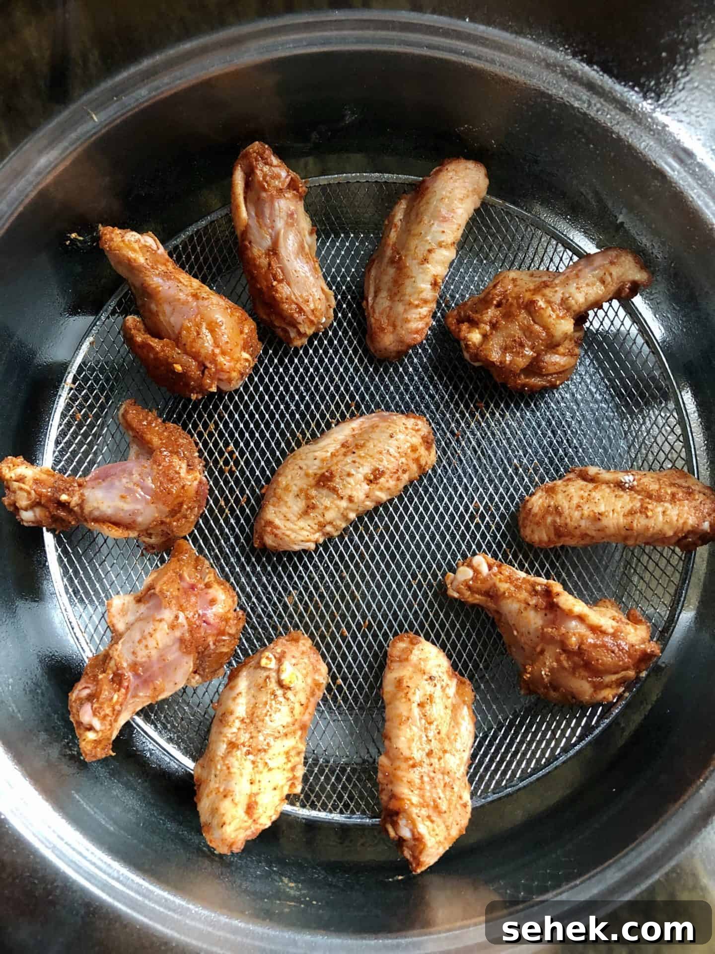Crispy Air Fryer Wings for Game Day 9 Chicken wings placed in air fryer basket ready to be fried overhead shot