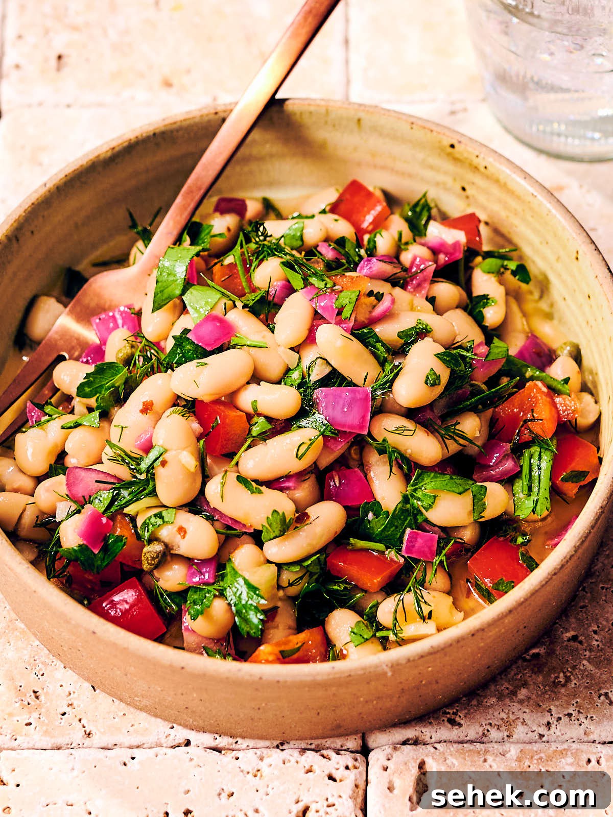 Tuscan Bean Salad with Tomatoes, Olives & Fresh Herbs 2 Tuscan bean salad with dill and bell peppers in a bowl.